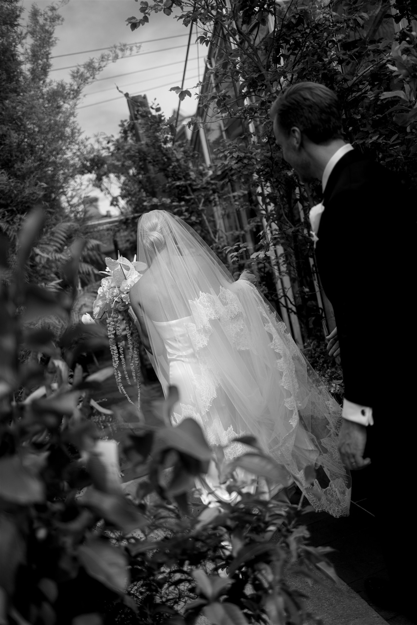 brides beautiful wedding dress and bridal veil by Kyha studios