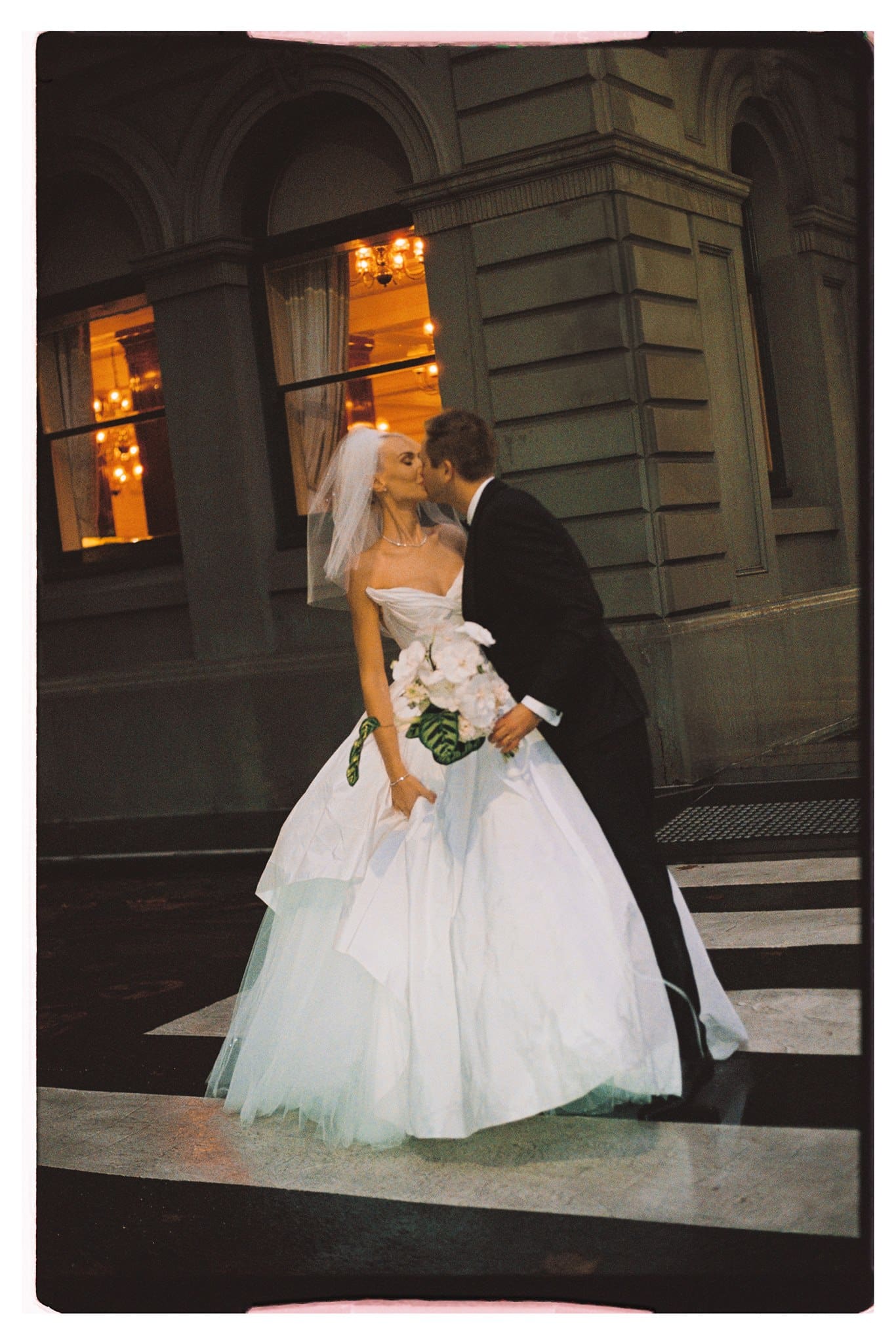 Bride and Groom walking through the streets of Melbourne captured in 35mm film