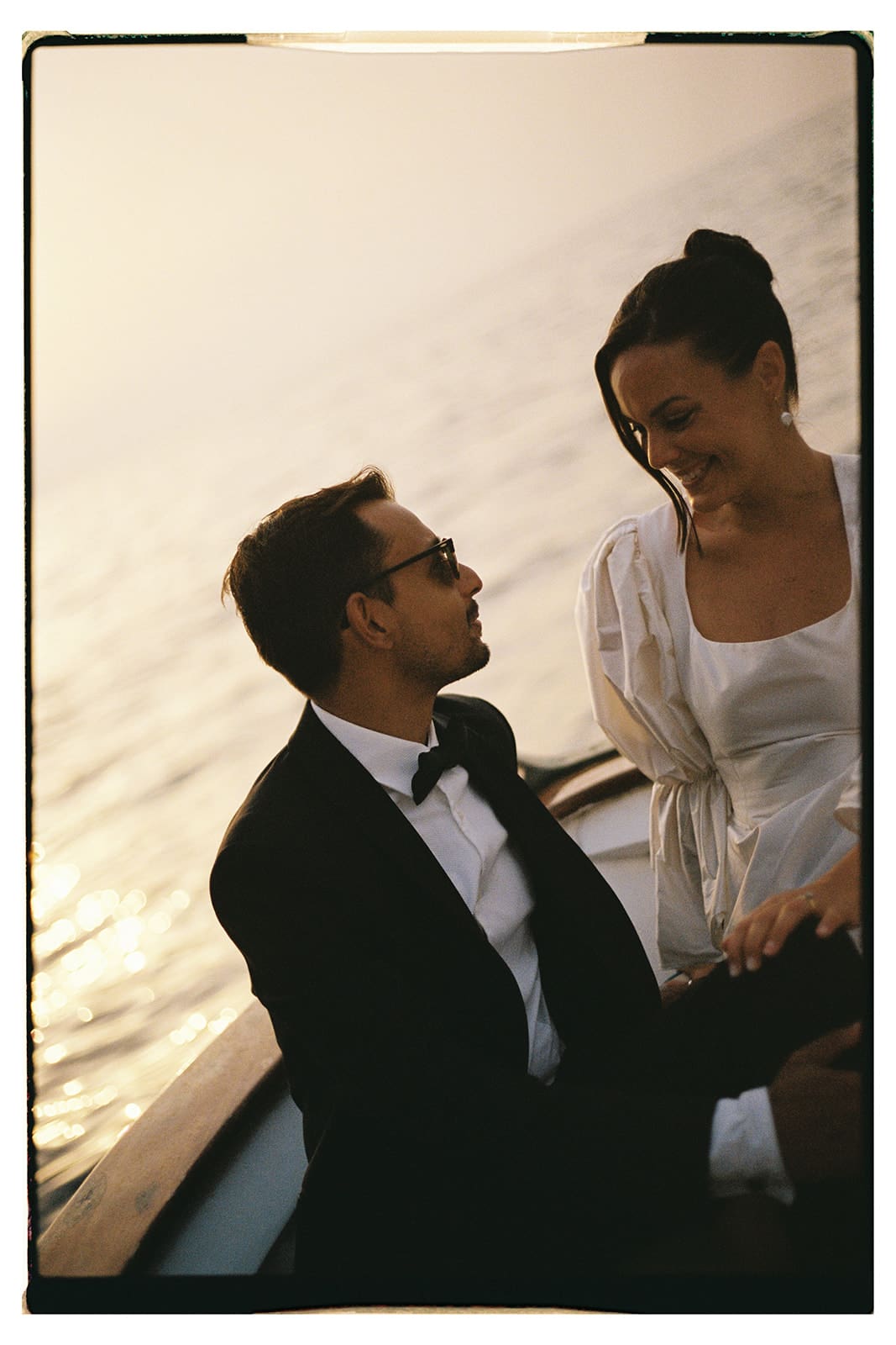 Bridal portraits on a yacht around the cliffs of Capri, Italy