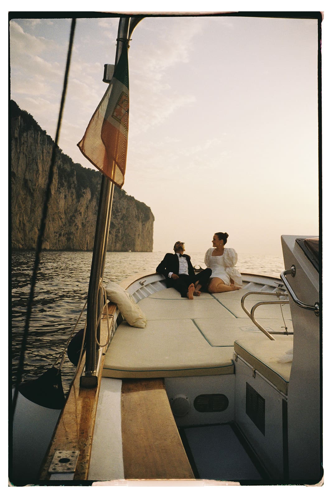 Bridal portraits on a yacht around the cliffs of Capri, Italy